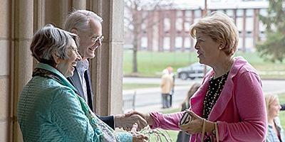 BMPC church members greeting one another at a worship service